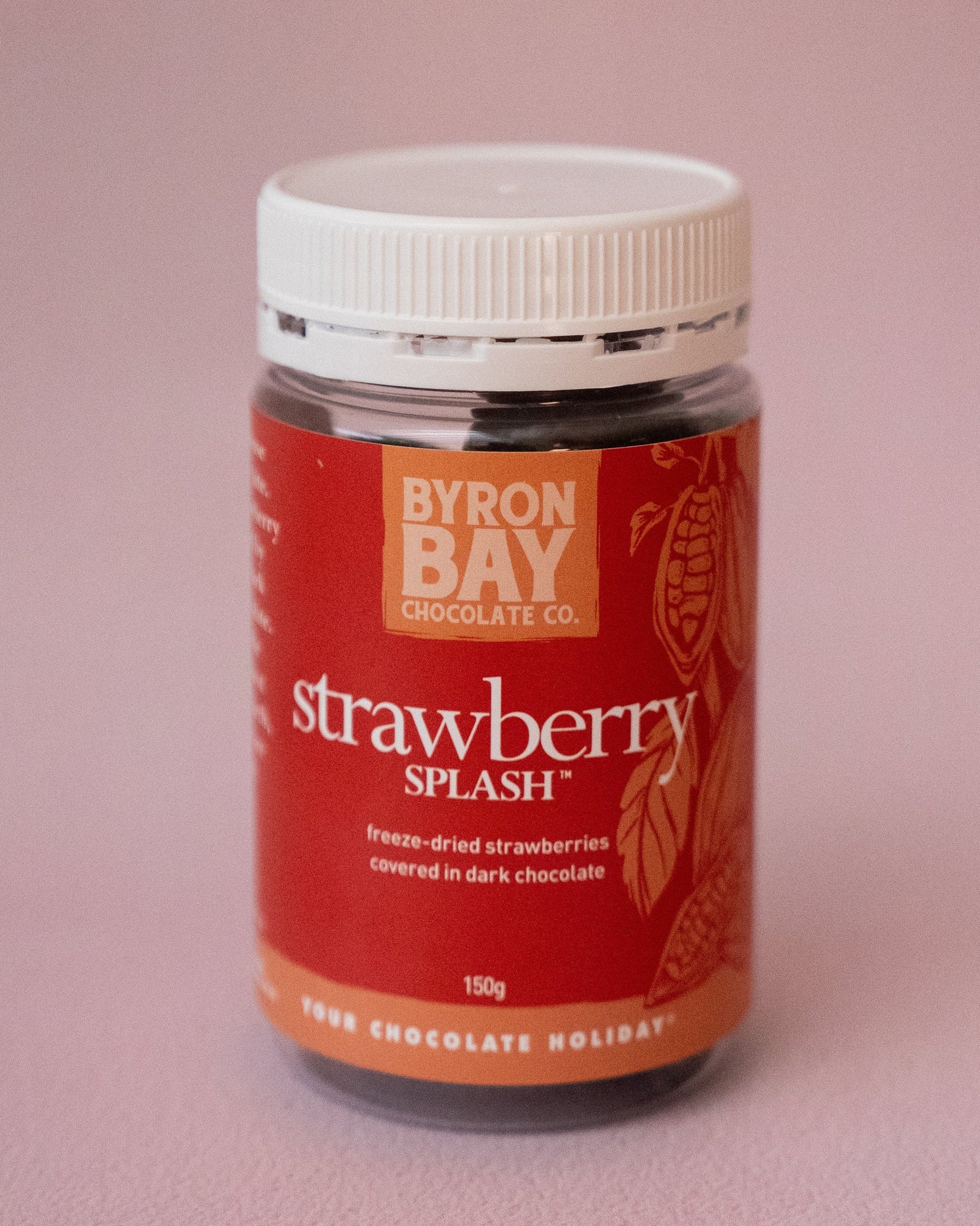 Jar of Byron Bay strawberry splash chocolate on a pink background