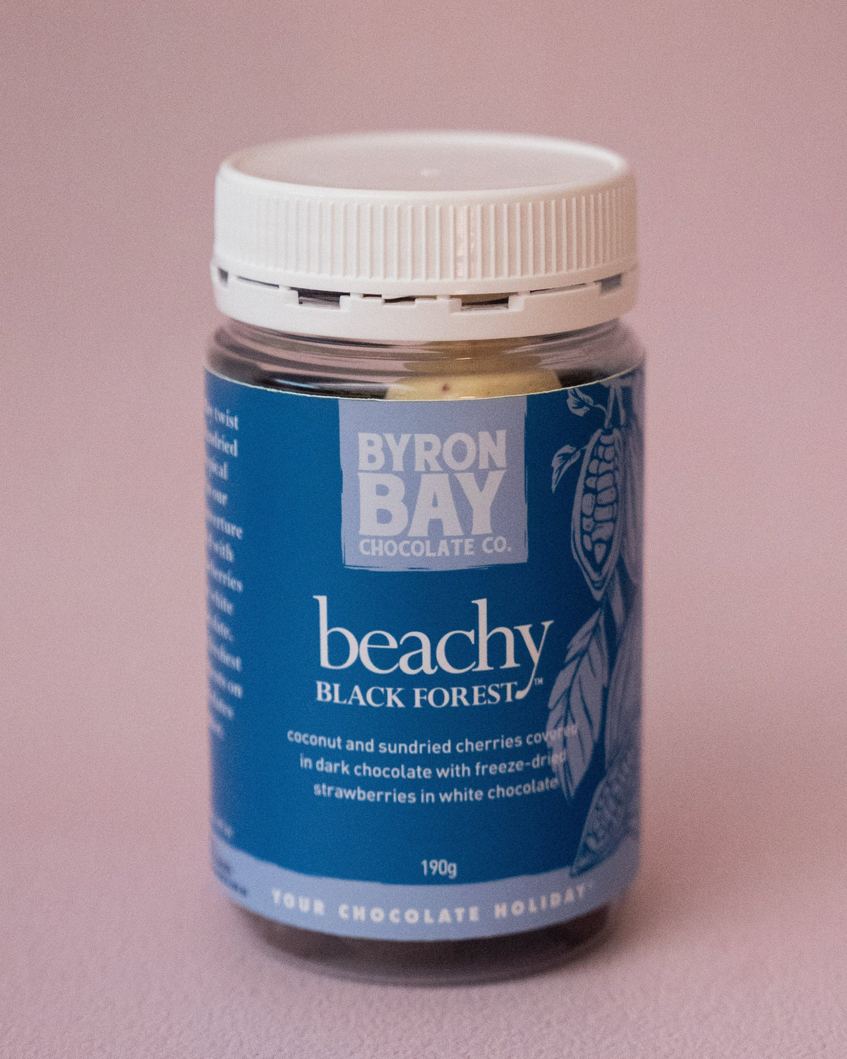 Jar of Byron Bay chocolate on a pink background