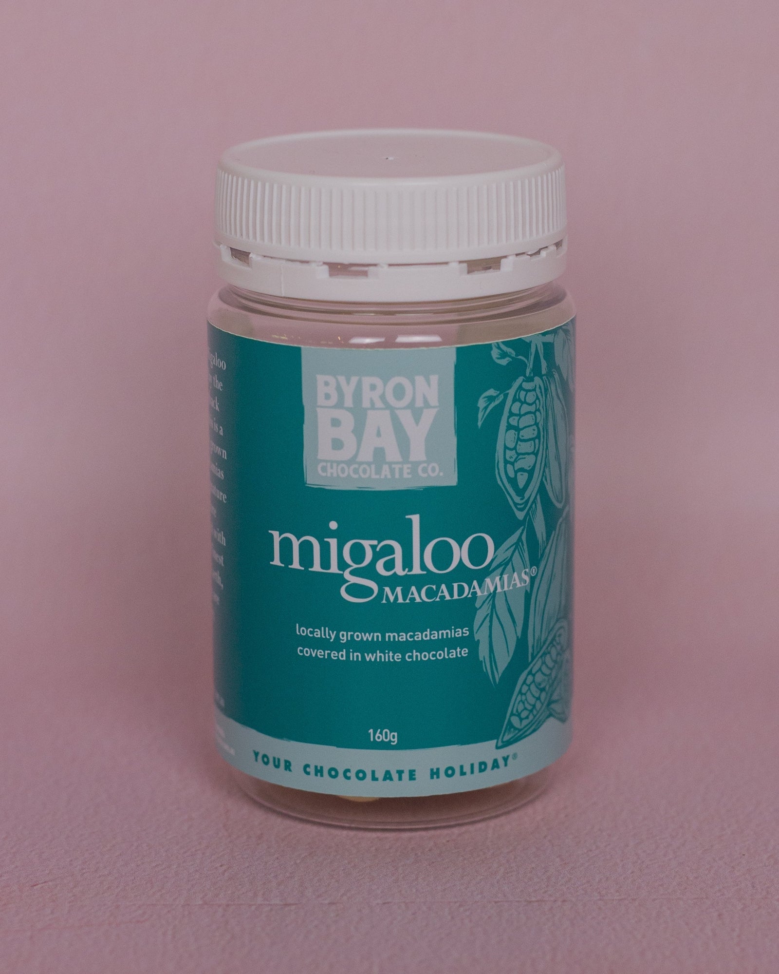 Jar of Byron Bay Macadamia nuts on a pink background