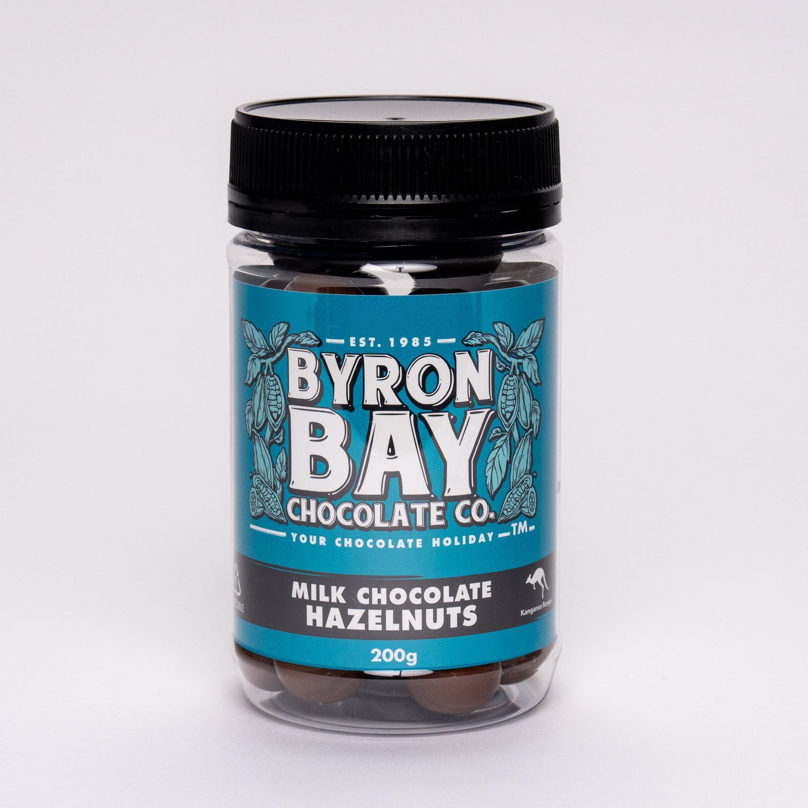 Jar of Byron Bay Chocolate Co. milk chocolate hazelnuts on a white background