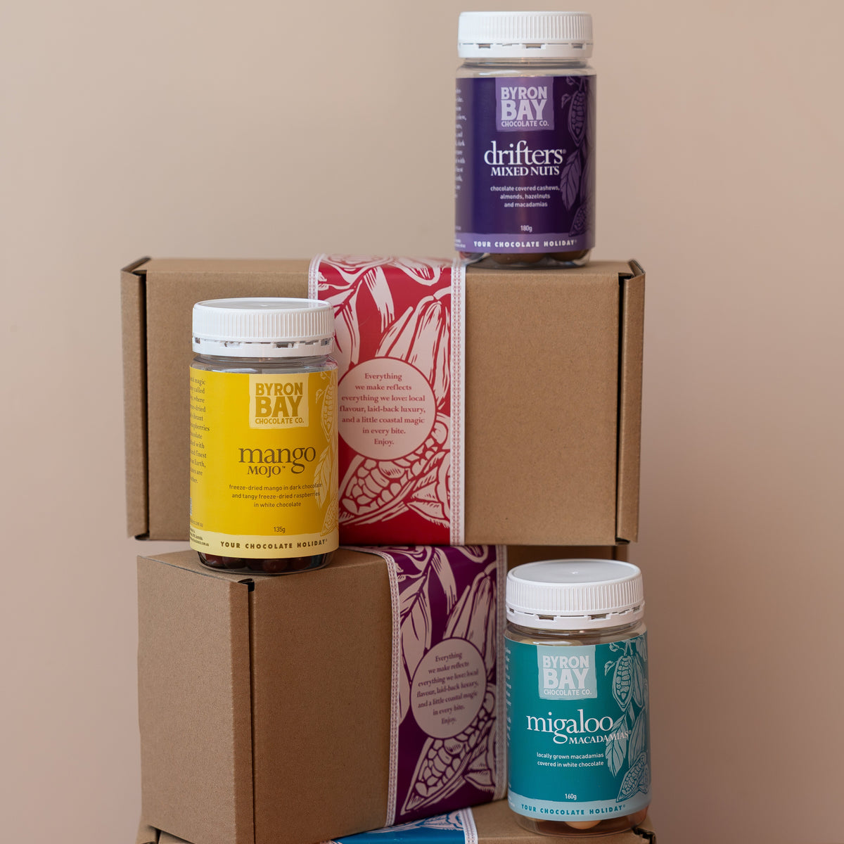 Stack of boxes with various containers on a beige background